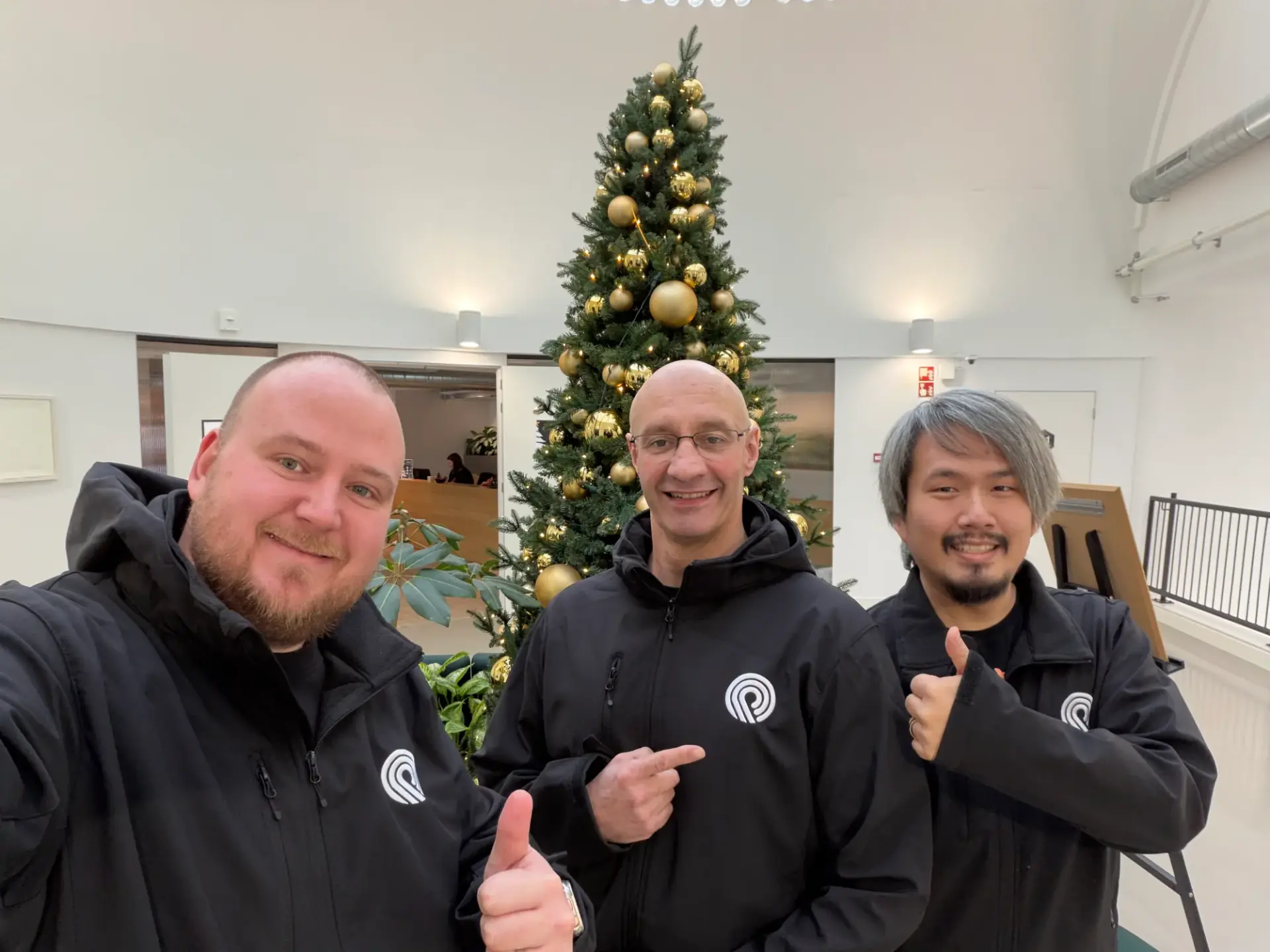 DevOptix consultants in branded jackets at the Utrecht office